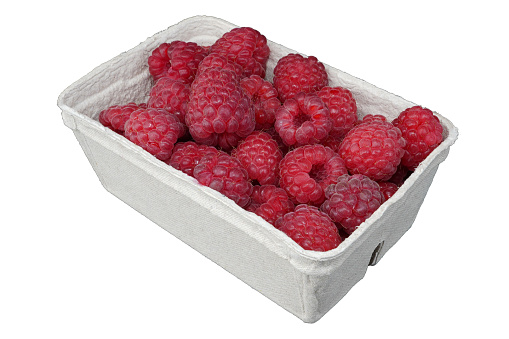 Raspberries in a box. Ripe and juicy raspeberries. Raspberry. Fruits.