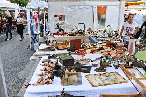 People visit Altstadtsauber flea market in Klagenfurt, Austria. Klagenfurt is the 6th largest city in Austria.