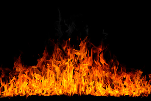 Shape of a fire burning. Yelow and orange flame on black background.