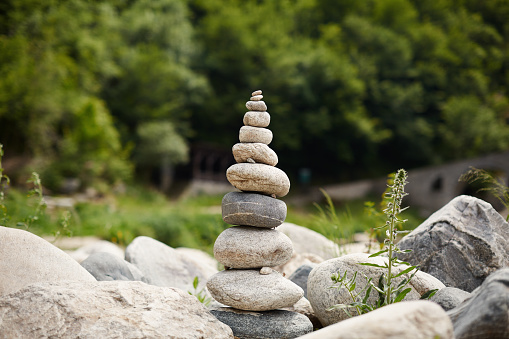 Zen stones and pebble rocks stacked on top of each other in balance