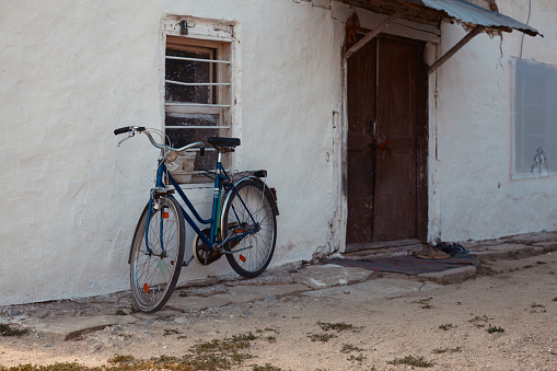 House with bicycle at the door in a Mediterranean village near Barcelona. Montgat