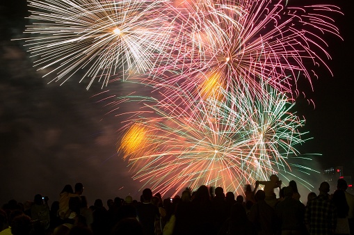 Multicolor Firework Celebration over the Part of earth with network line and point on the star and Milky Way background, Elements of this image furnished by NASA, Independence day concept