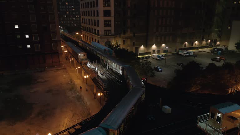 Train passing on Elevated Track at Night. Subway in downtown Chicago