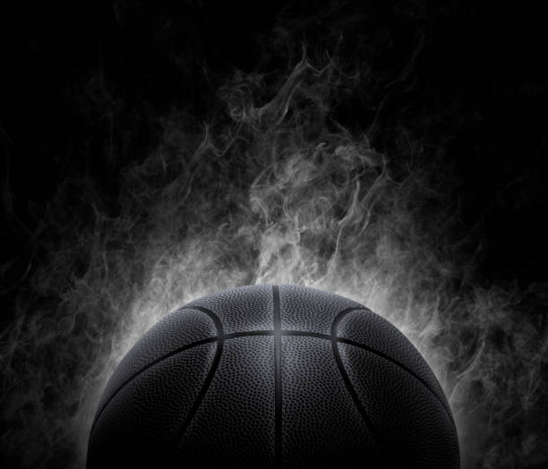 Orange leather basketball on blue floor
