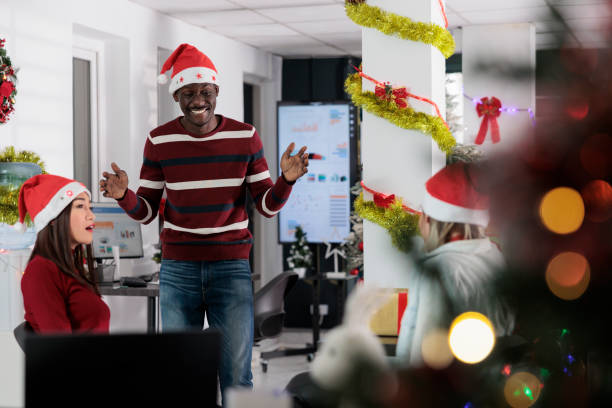 istock Team enjoying coffee break during xmas 1539672719