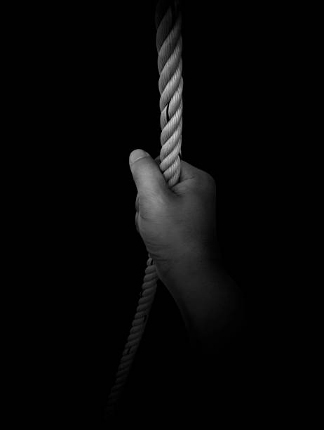 istock Man's hand holding on to the rope. On a white background 1539676484