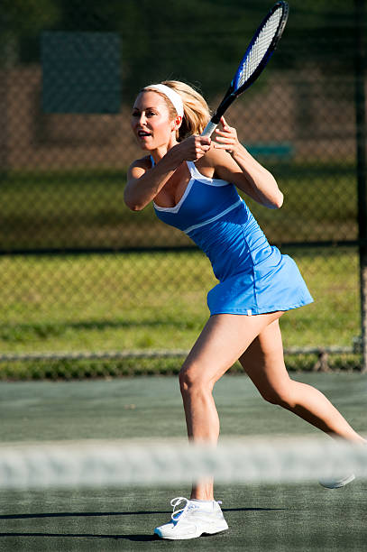 istock Blonde Woman Playing Tennis 153967659