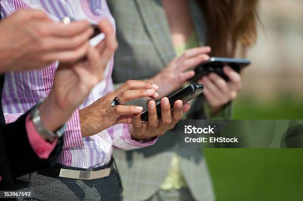 Three Businesswomen Texting Stock Photo - Download Image Now - Adult, Adults Only, Business