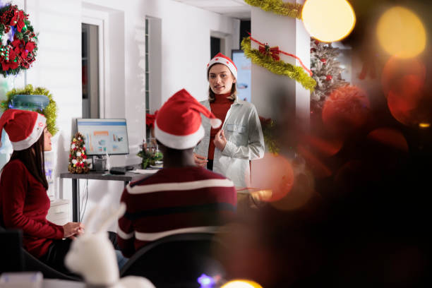 istock Manager chats with employees during xmas 1539677593