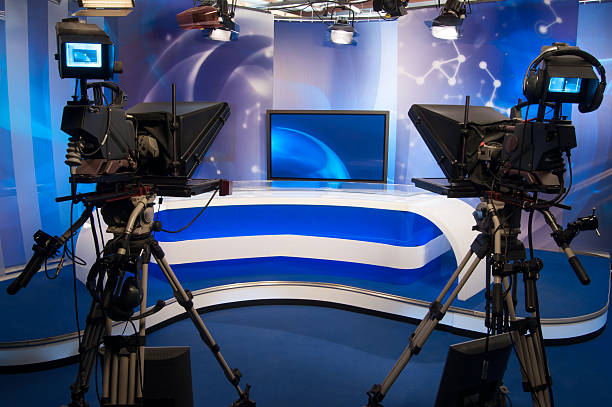 istock A TV set with cameras and a news desk 153967921