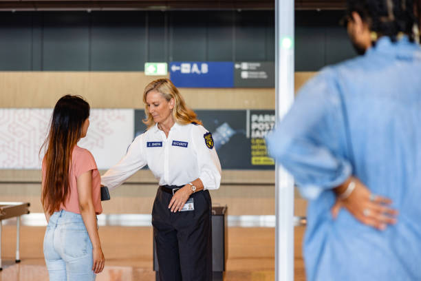 istock Smooth Airport Journey: Professional Staff at Security Check 1539686126