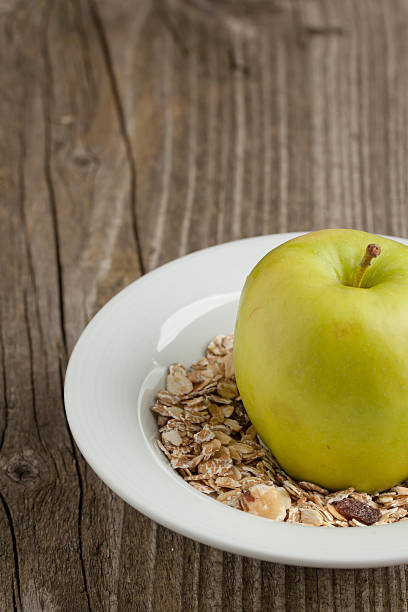 istock Plate of muesli with green apple 153969054