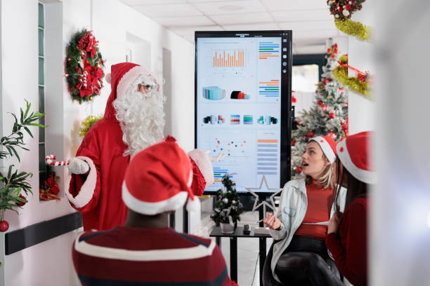 istock Coworker dressed as Santa Claus 1539692530