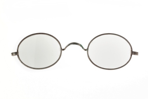 Old vintage eyeglasses isolated over white