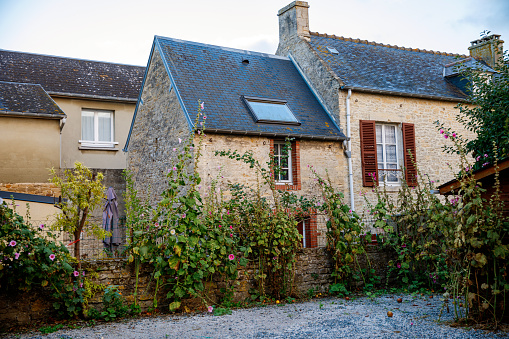 Quaint French village in scenic Normandy, showcasing historic charm and tranquil countryside,