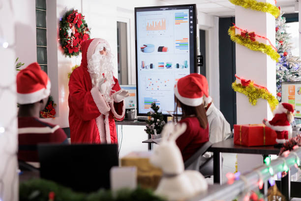 istock Public speaker dressed as Santa Claus 1539699736