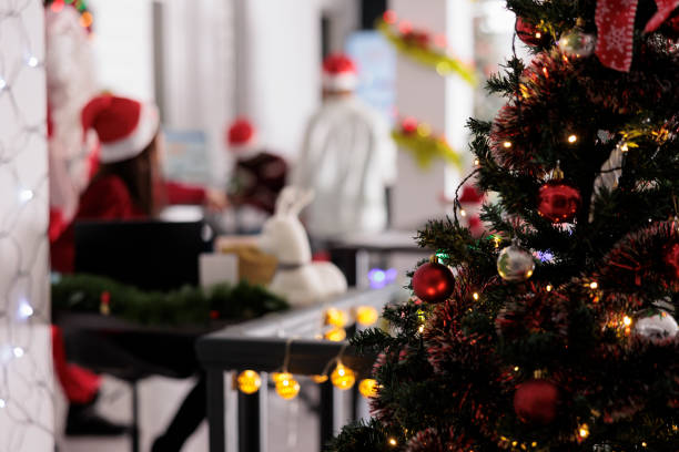 istock Christmas tree close up with employees 1539710543
