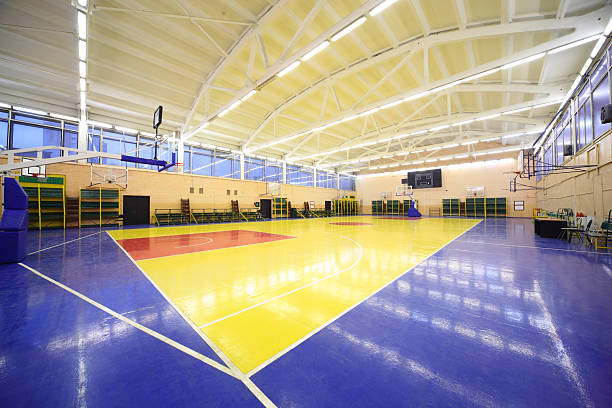 istock View from the corner inside lighted school gym hall 153971273