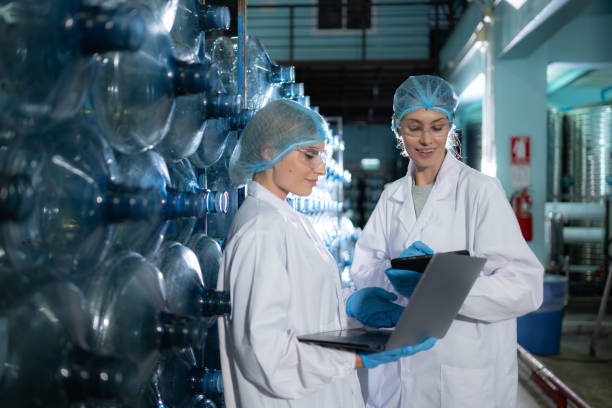 istock Two young female scientists working with tablet computer in drinking water plant 1539726130