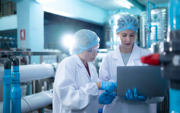 istock Two young female scientists working with tablet computer in drinking water plant 1539727202