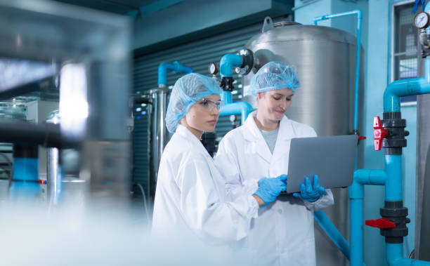 istock Two young female scientists working with tablet computer in drinking water plant 1539727210