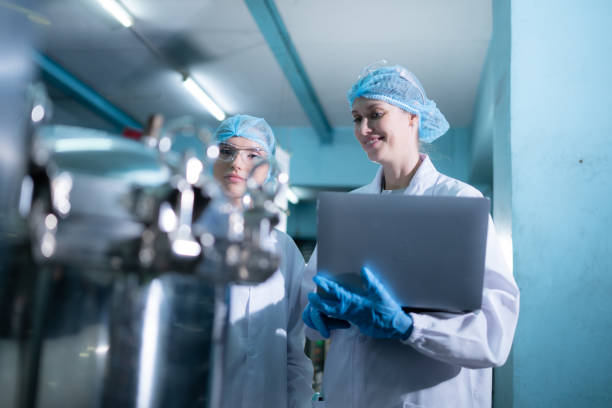 istock Two young female scientists working with tablet computer in drinking water plant 1539727743