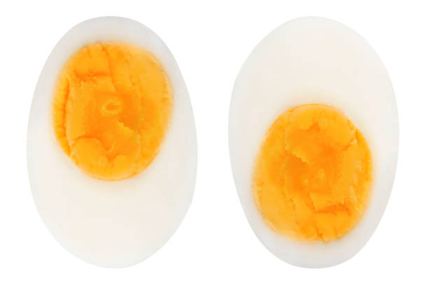 Sliced eggs on an isolated white background. Sliced eggs on an isolated white background. boiled egg cut out stock pictures, royalty-free photos & images