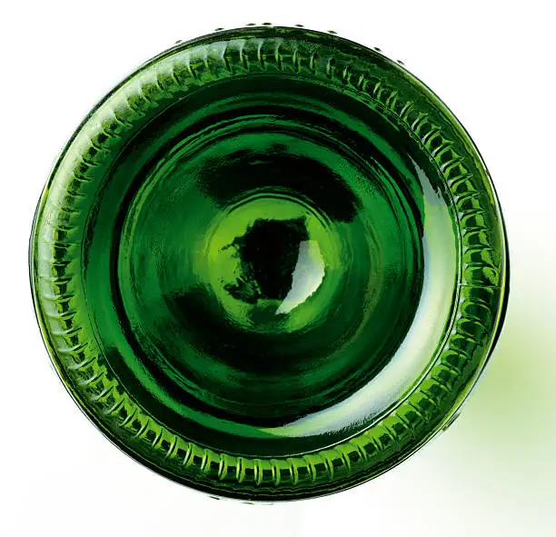 This is a graphic shot of the base of a green wine bottle