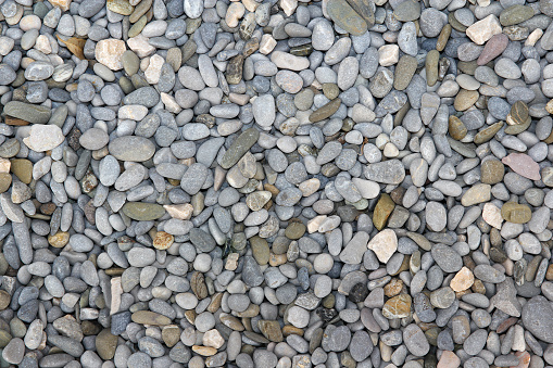 grey pebble on the beach - background texture