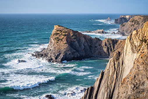 Praia da Arrifana beach sea cliffs in Vicentine Coast, Algarve, Portugal