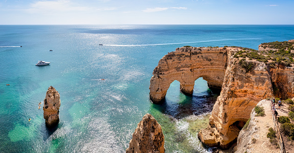 Wooden footbridge to beautiful beach Praia do Camilo near Lagos in algarve region, Portugal