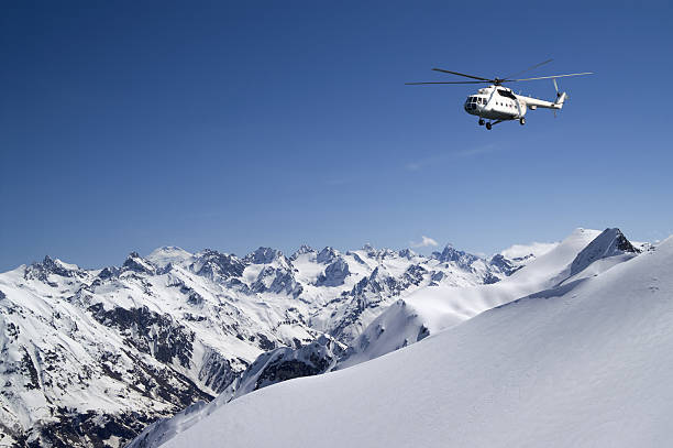 Helicopter in snowy mountains