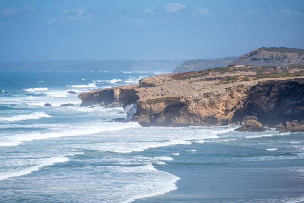 istock rock cliff at praia Monte Clerigo beach 1539789916