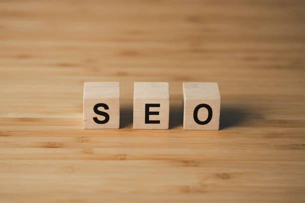 istock SEO Search Engine Optimization wooden cube block on wooden table. business strategy and marketing  concept 1539795281