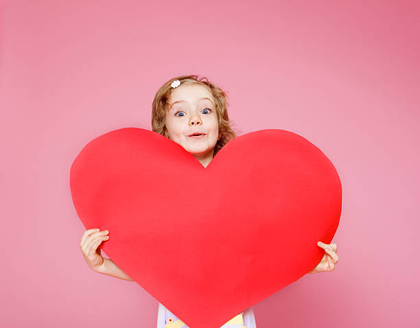 istock Girl holding paper heart 153980062