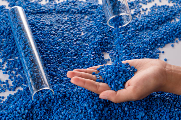 istock White plastic grain, plastic polymer granules,hand hold Polymer pellets, Raw materials for making water pipes, Plastics from petrochemicals and compound extrusion, resin from plant polyethylene. 1539806425