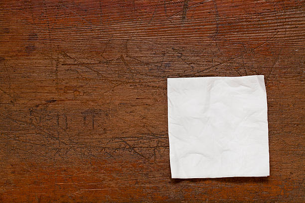 white napkin on wood table stock photo