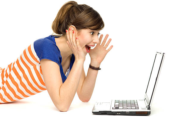 istock Surprised young woman using laptop 153981297