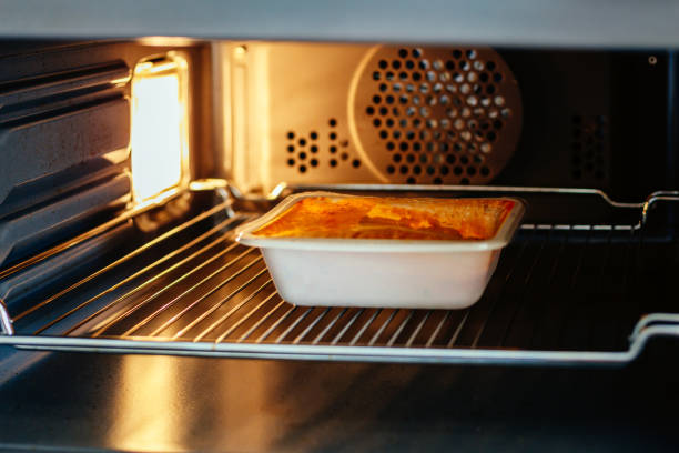 A ready meal - in this case a chicken curry - in the microwave at home.