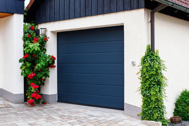 istock automatic garage doors near manicured blooming roses 1539824044