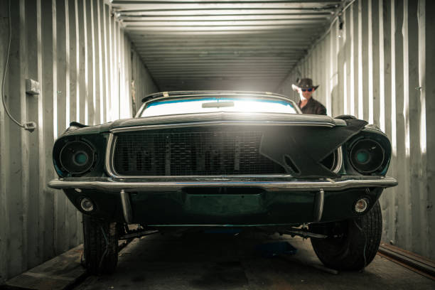 istock Damaged Classic American Muscle Car Inside a Shipping Cargo Container 1539843168