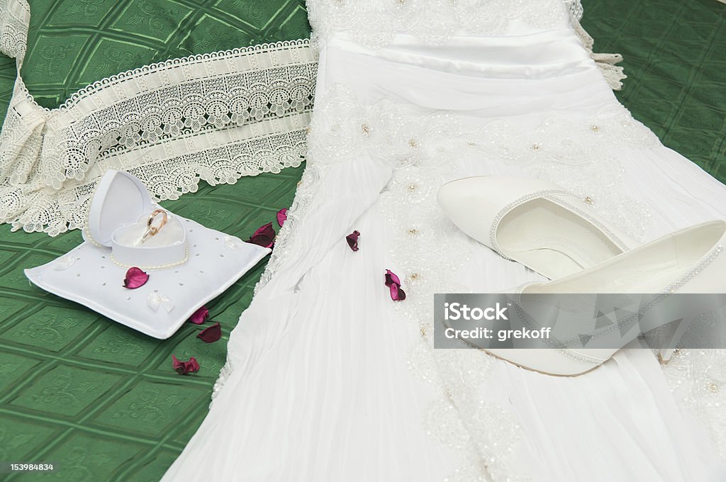 Wedding accessories Wedding accessories on a green coverlet Backgrounds Stock Photo
