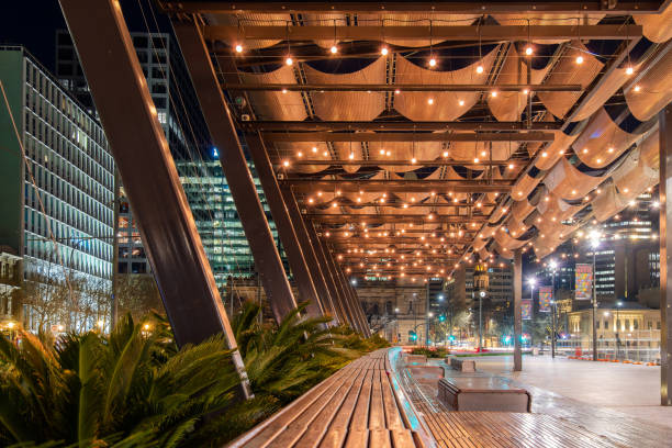 Adelaide, Australia - September 10, 2019: Victoria Square in Adelaide city viewed towards north while illuminated at night time.