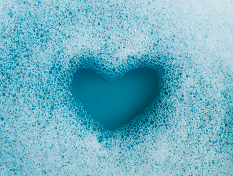 soap suds made into a heart shape, view from above