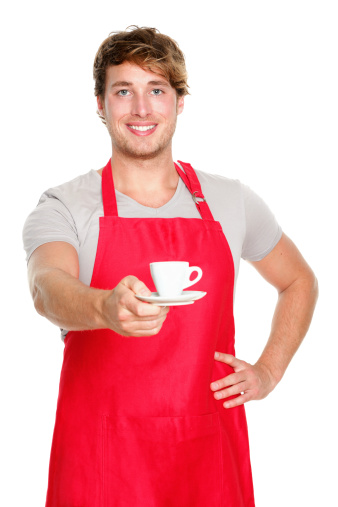 Barista / waiter man serving coffee wearing apron. Handsome young small coffee shop business owner isolated on white background.