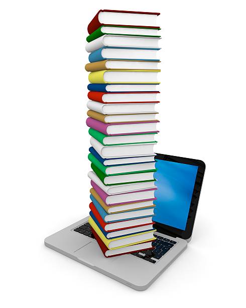istock Pile of books on laptop 153987611