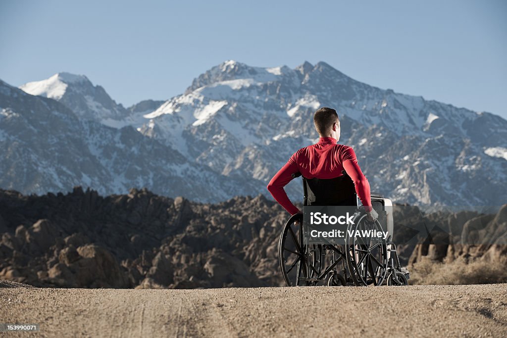 inspired A man in a wheelchair looking at the mountains Activity Stock Photo inspired A man in a wheelchair looking at the mountains Activity Stock Photo