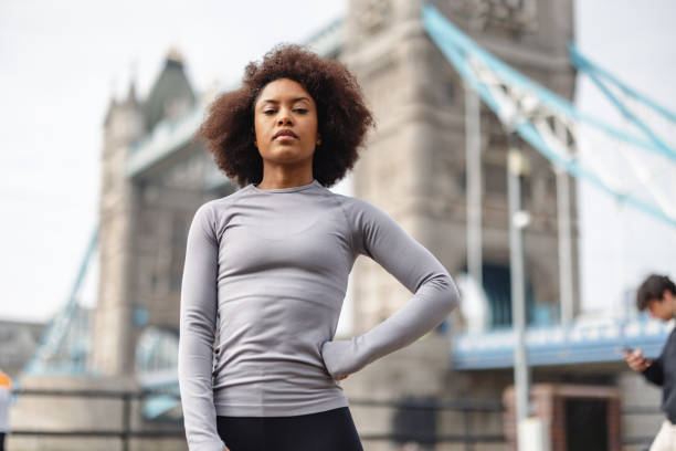 istock Serious African-American Woman Warming Up Before Exercising 1539904609