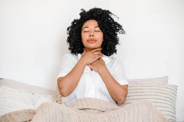 istock sick afro american woman feeling sore throat 1539910076
