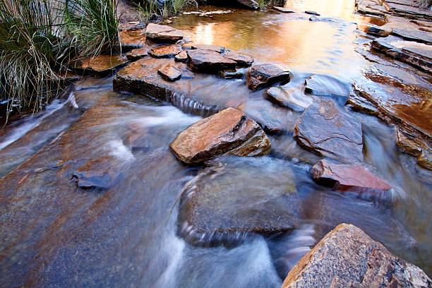 Water flowing over boulders stock photo